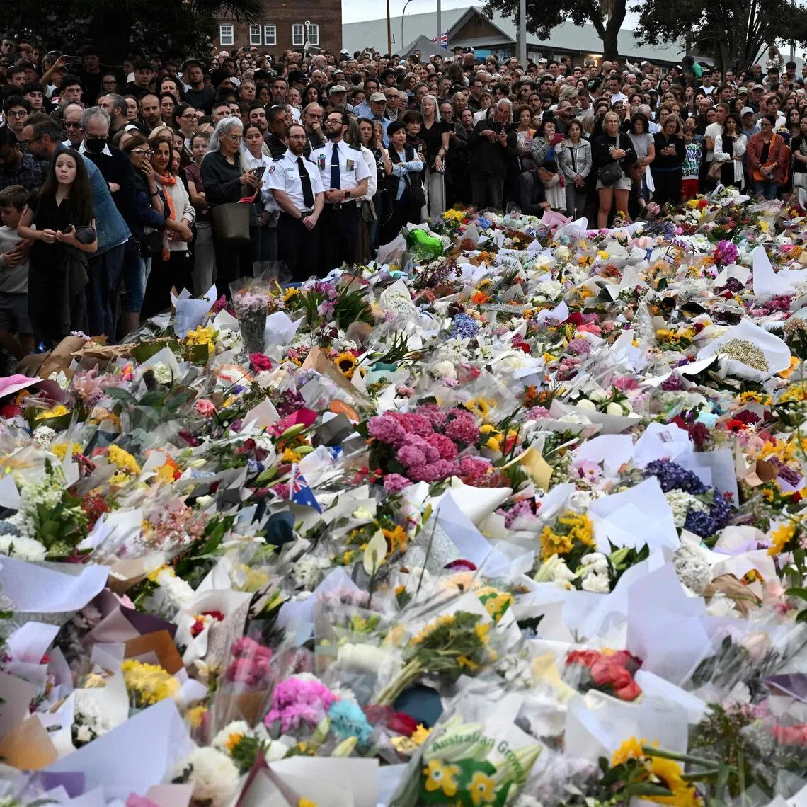 Mourners gather at a tribute at the Bondi Pavilion in memory of the victims of a shooting at Bondi Beach, in Sydney, on Dec 16, 2025. 