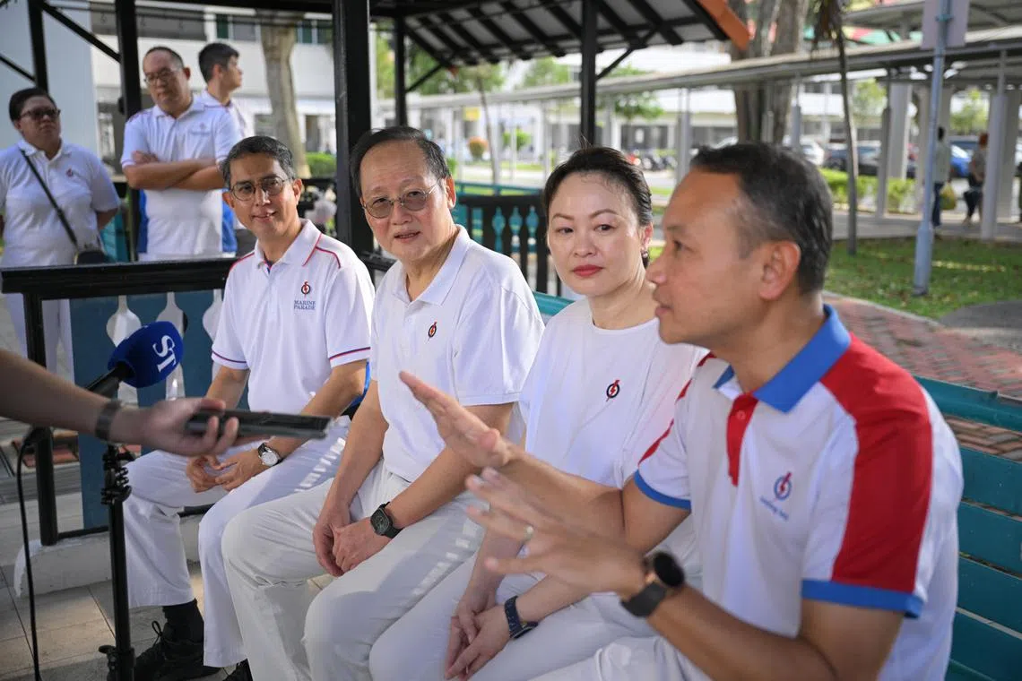(PLS NOTE: THIS IS AN ST EXCLUSIVE. PLS CHECK WITH JOYCE LIM BEFORE SHARING TO OTHER PUBS) Marine Parade MP Tan See Leng (second from left), accompanied by (from left) Associate Professor Muhammad Faishal Ibrahim, an MP at Nee Soon GRC, Diana Pang, the chairman of Fengshan Women's Executive Committee and People?s Association Women's Integration Network (WIN) Council and incumbent MP for Geylang Serai ward Fahmi Aliman, gives a doorstop to The Straits Times behind the PAP Geylang Serai branch before they visited Eunos Crescent Market and Food Centre on March 30, 2025.