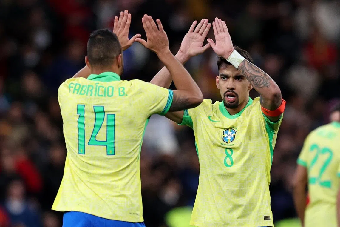 FILE PHOTO: Soccer Football - International Friendly - Spain v Brazil - Santiago Bernabeu, Madrid, Spain - March 26, 2024  Brazil's Lucas Paqueta celebrates scoring their third goal with Fabricio Bruno REUTERS/Violeta Santos Moura/File Photo