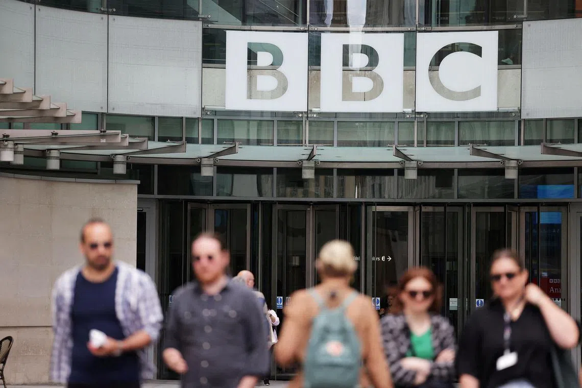 People walk outside BBC headquarters in London, Britain.
