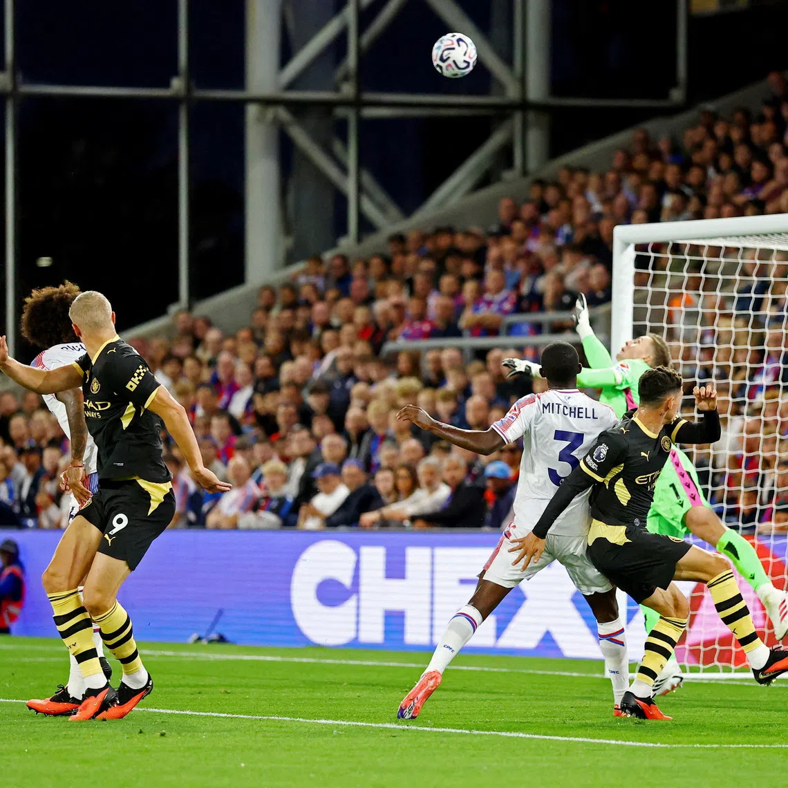 Manchester City’s Erling Haaland scores their first goal past Crystal Palace’s Dean Henderson.