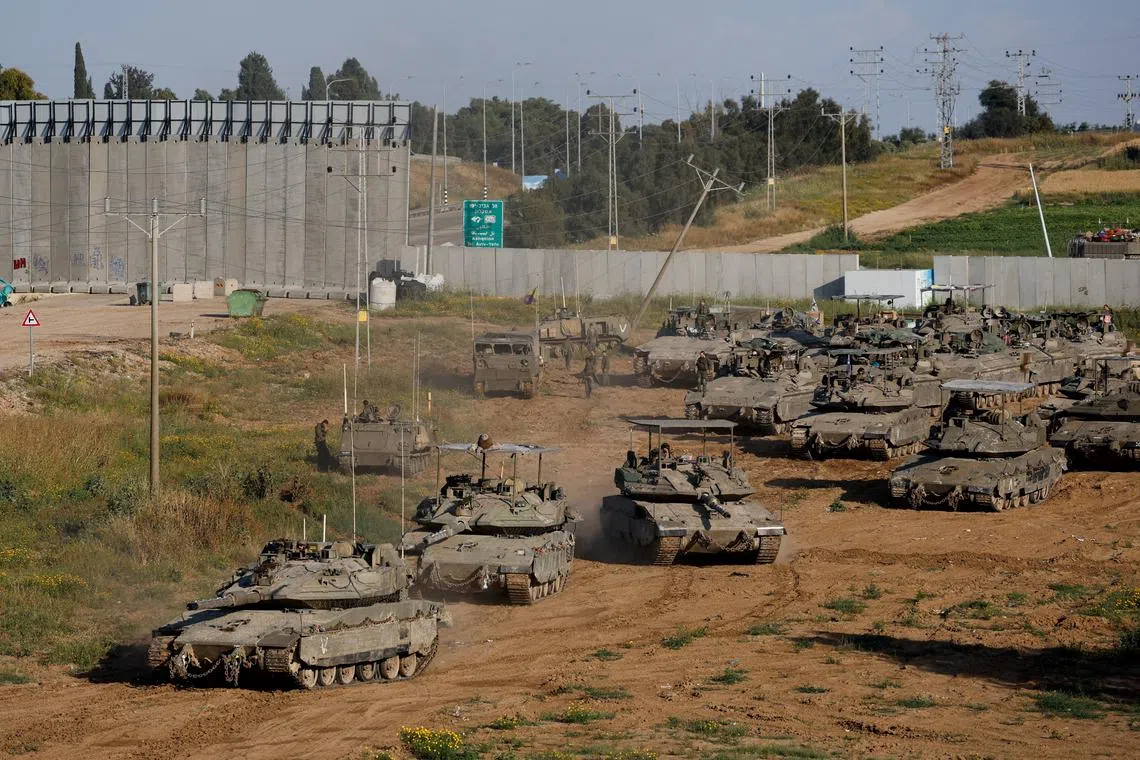FILE PHOTO: Israeli tanks manoeuvre on their way to Gaza, amid the ongoing conflict between Israel and the Palestinian Islamist group Hamas, near the Israel-Gaza border, in Israel, April 10, 2024. REUTERS/Amir Cohen /File Photo