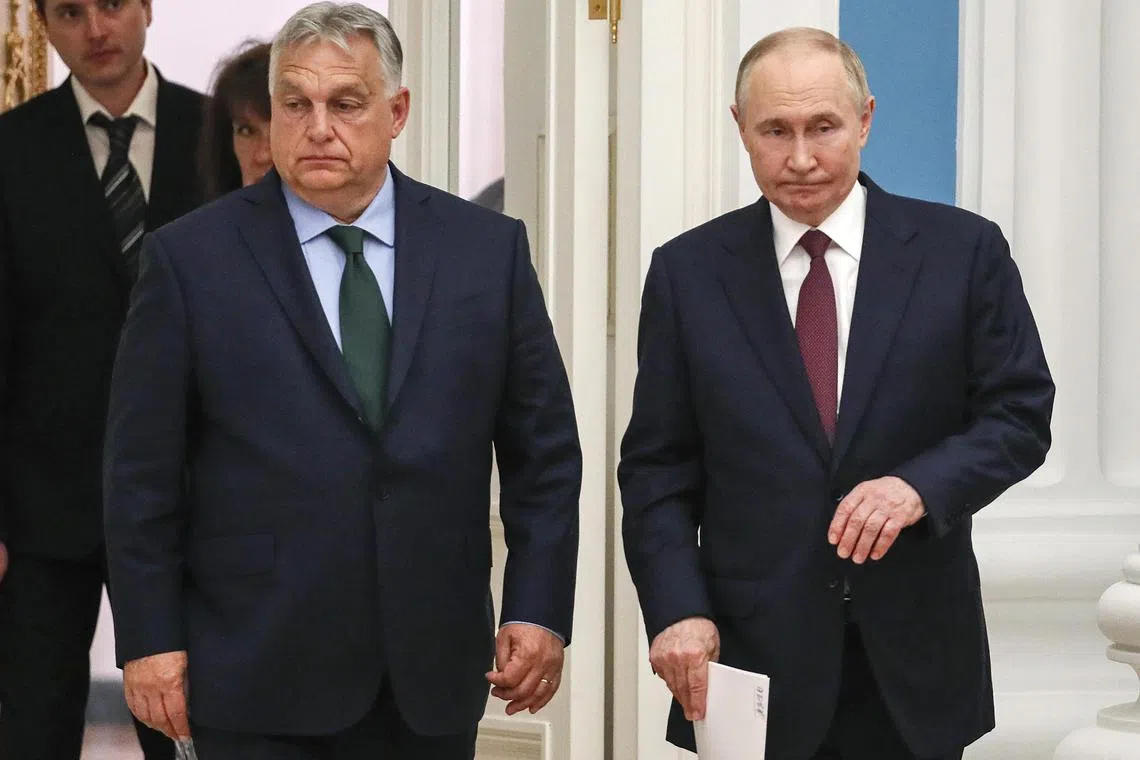 Hungarian Prime Minister Viktor Orban (left) and Russian President Vladimir Putin arriving for a press conference after their bilateral talks in Moscow, on July 5.