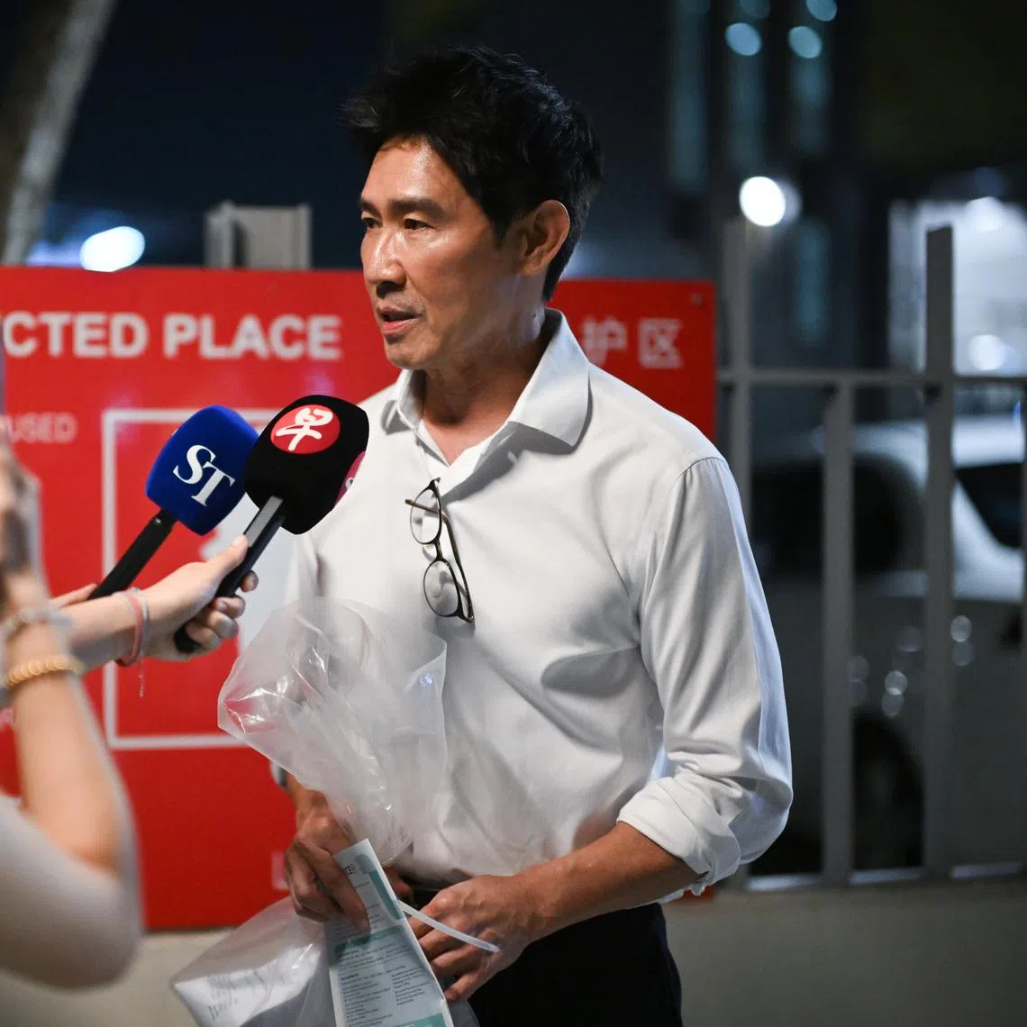 Former actor Edmund Chen speaking to the media after coming out of Changi Prison at 9.40pm on July 20, 2026.