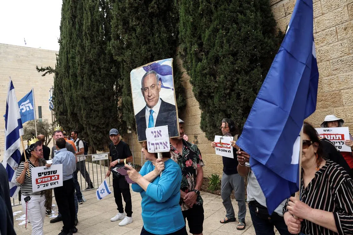 Ruckus in Israeli court as hearings begin on Netanyahu bid to sack spy chief