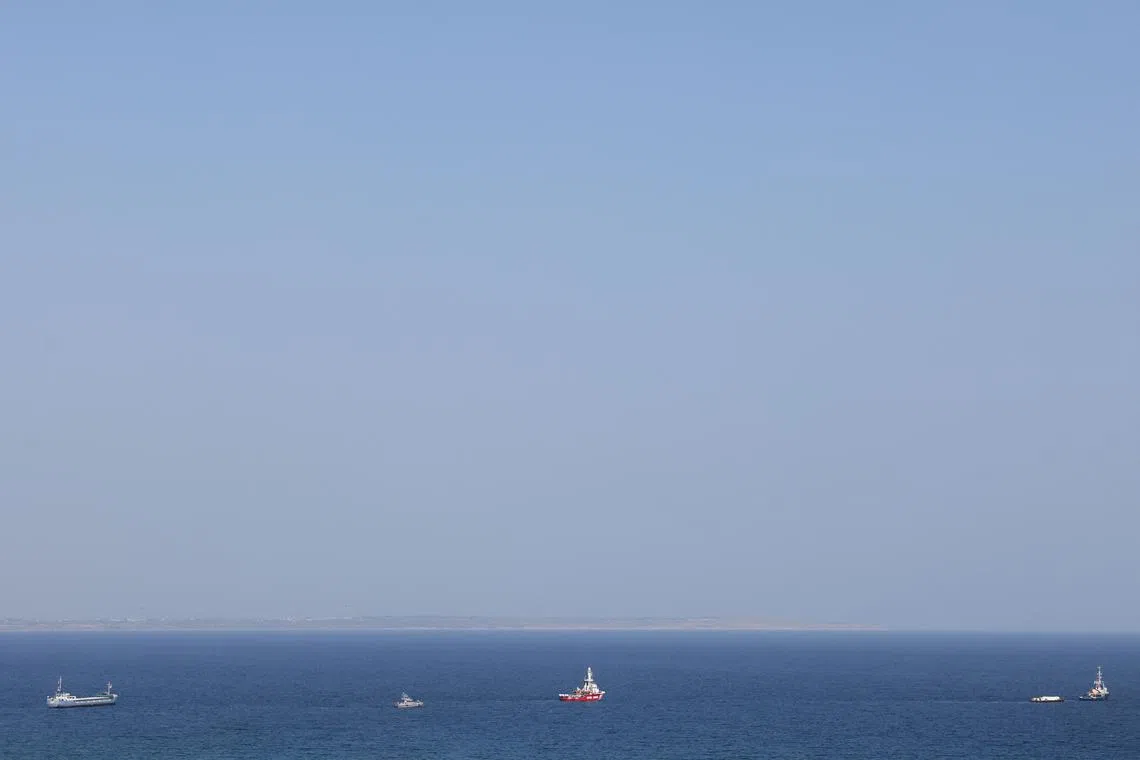 FILE PHOTO: The Open Arms, a rescue vessel owned by a Spanish NGO, a cargo ship and a tug boat depart with humanitarian aid for Gaza from Larnaca, Cyprus, March 30, 2024. REUTERS/Yiannis Kourtoglou/File photo