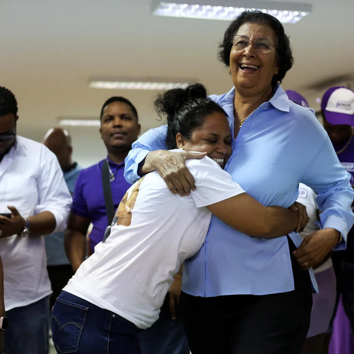 FILE PHOTO: Suriname's opposition leader Jennifer Geerlings-Simons of the National Democratic Party (NDP) celebrates with supporters as she proclaims herself the winner of the presidency as counting continues during the National Assembly election, in Paramaribo, Suriname, May 26, 2025. REUTERS/Ranu Abhelakh/File Photo