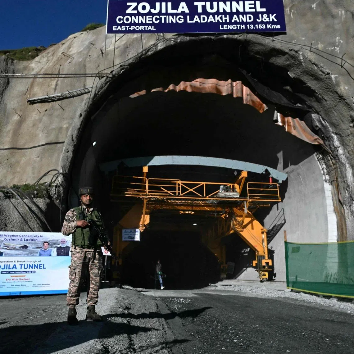 An Indian paramilitary personnel stands guard at the Zojila tunnel, India's longest road tunnel project connecting Jammu and Kashmir state with the Ladakh region on June 9.