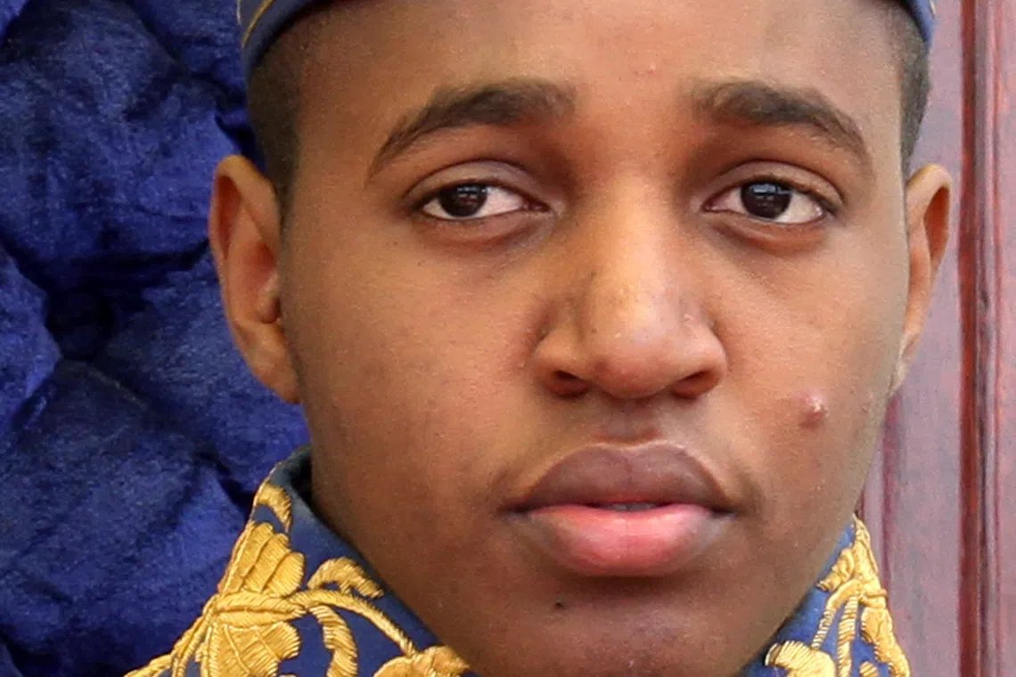 King Oyo Nyimba Kabamba Irugu Rukidi IV sits on the throne at his palace in Fort Portal, 270 km (168 miles) southwest of Kampala April 17, 2010. King Oyo, 18, the youngest king in the world, ascended the throne aged three, after his father, the late King Patrick Kaboyo died in 1995.  REUTERS/James Akena