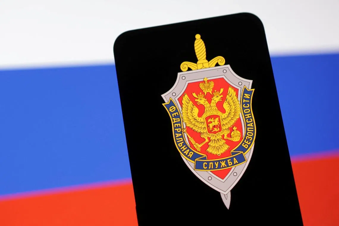 FILE PHOTO: FSB (Federal'naya Sluzhba Bezopasnosti) logo and Russian flag are seen in this illustration taken May 6, 2025. REUTERS/Dado Ruvic/Illustration/File Photo