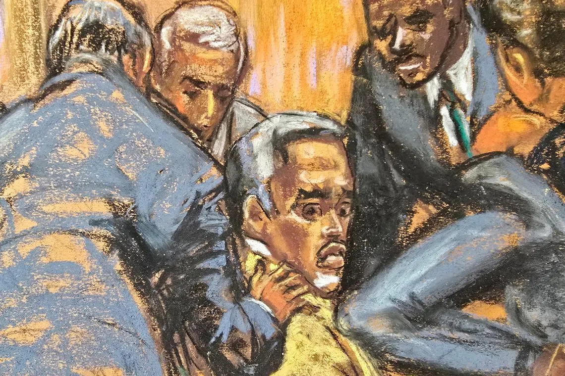 Defense lawyers comfort Sean \"Diddy\" Combs while discussing how to handle a note sent by jurors that they had reached a verdict on four of the five counts against him, during Combs' sex trafficking trial in New York City, New York, U.S., July 1, 2025, in this courtroom sketch. REUTERS/Jane Rosenberg