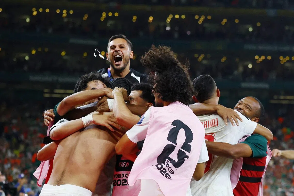 Soccer Football - FIFA World Cup 2026 - Round of 32 - Netherlands v Morocco - Estadio Monterrey, Monterrey, Mexico - June 29, 2026 Morocco's Ayoub El Kaabi and teammates celebrate after the penalty shootout as Morocco qualify for the round of 16 stage of the World Cup REUTERS/Daniel Becerril