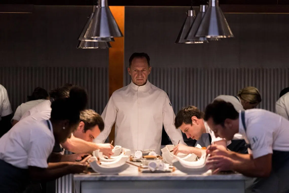 The Menu starring Ralph Fiennes (centre) skewers top tier restaurants and fine dining.