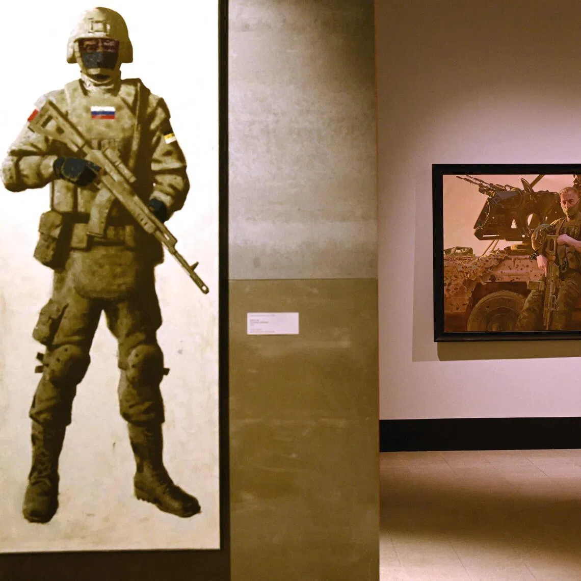 A visitor tours "The Russian Imperative" art exhibition at the Manezh Central Exhibition Hall in Saint Petersburg.