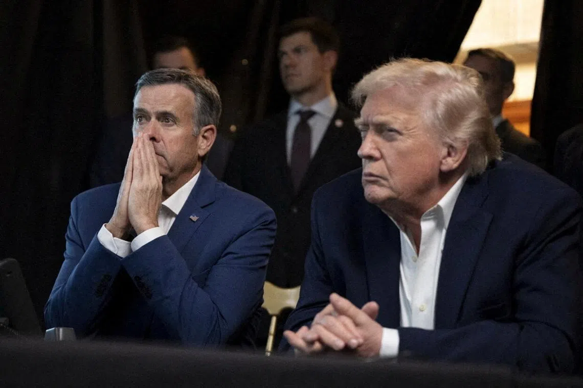 FILE PHOTO: A photograph posted by U.S. President Donald Trump on his Truth Social account shows him sitting next to CIA Director John Ratcliffe as they watch the U.S. military operation in Venezuela from Trump's Mar a Lago resort, in Palm Beach, Florida, U.S., January 3, 2026. @realDonaldTrump/Handout via REUTERS/File Photo
