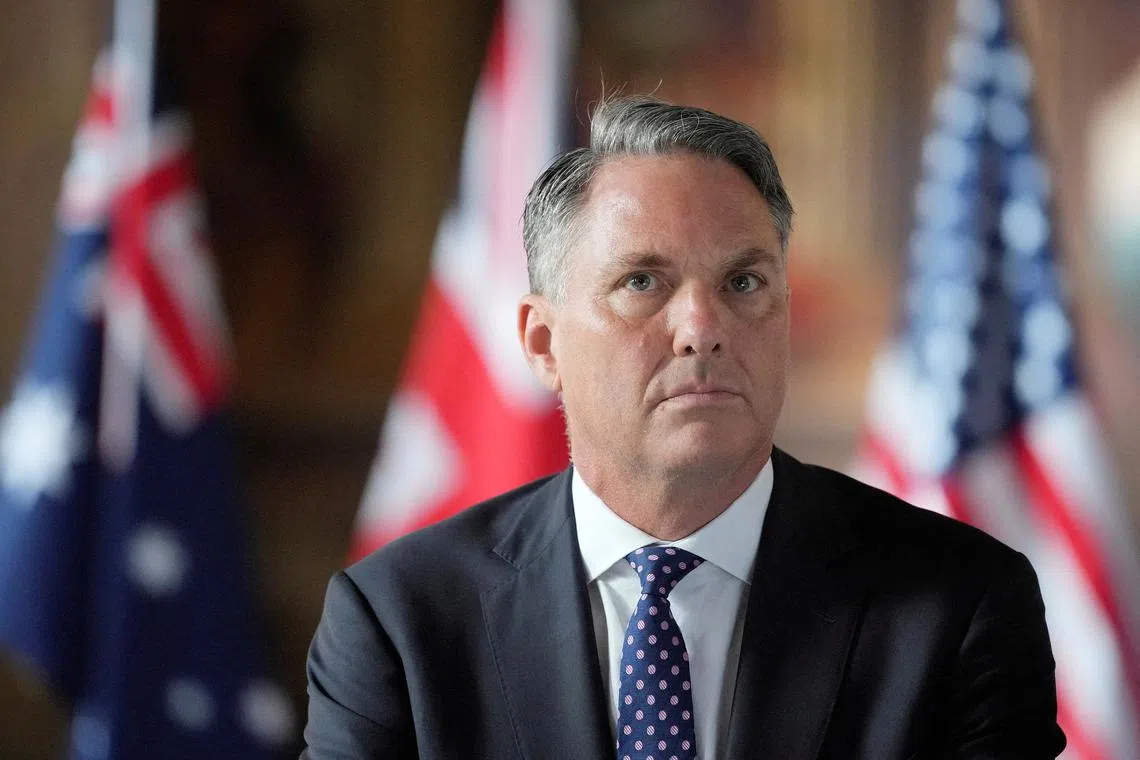 FILE PHOTO: Australian Defense Minister Richard Marles listens during the AUKUS Defence Ministers Meeting at Old Royal Naval College, Greenwich, London, Thursday, Sept. 26, 2024.  Kin Cheung/Pool via REUTERS/File Photo