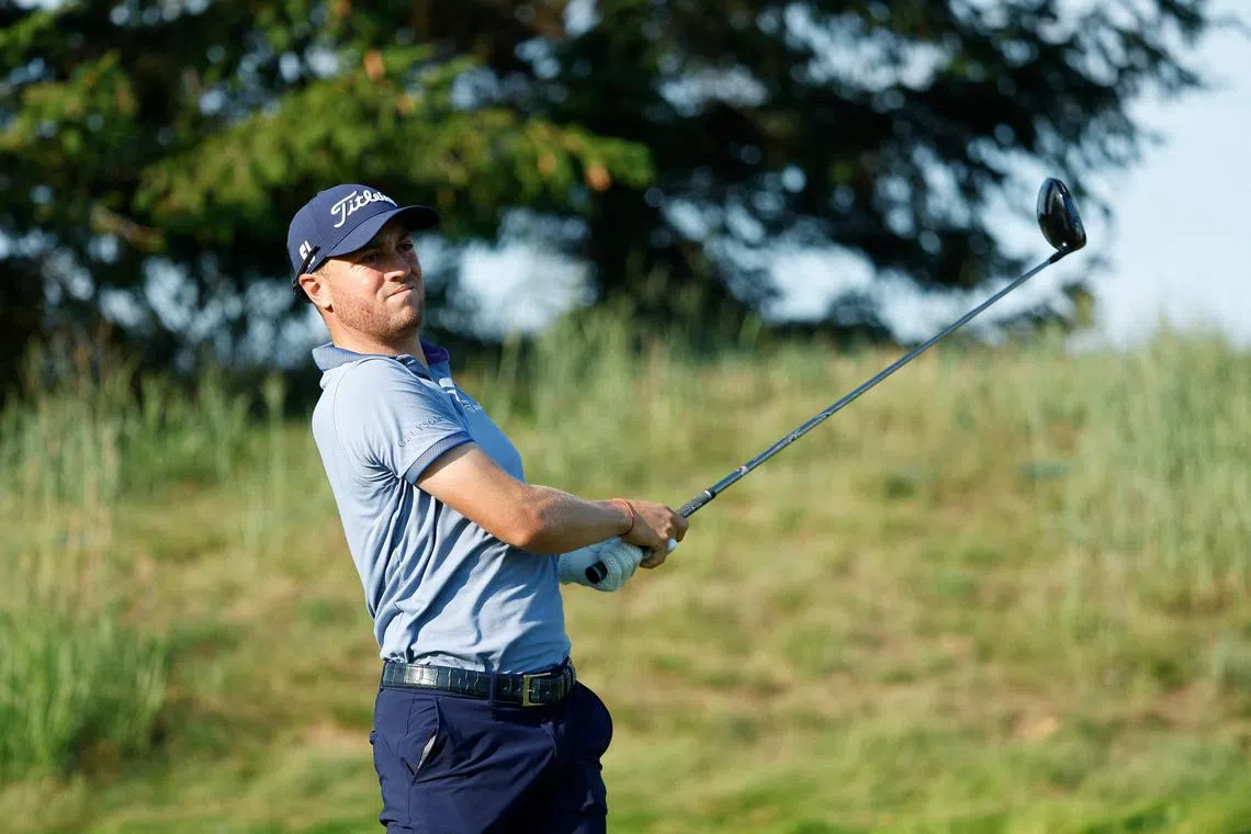 Justin Thomas watches his tee shot on the 12th hole during the second round of the 3M Open.