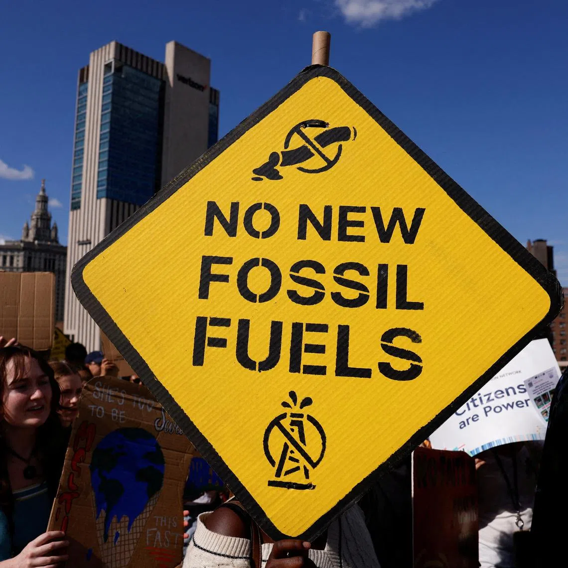 FILE PHOTO: Demonstrators march across the Brooklyn Bridge, rallying to call an end to the era of fossil fuel, New York City, U.S., September 20, 2024. REUTERS/Shannon Stapleton/File Photo