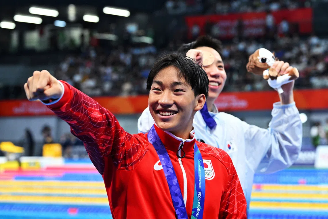 Japan’s Shin Ohashi celebrating after winning the men’s 200m breaststroke in a world record at the Tokyo Aquatics Centre in the Aichi-Nagoya Asian Games on Sept 24.