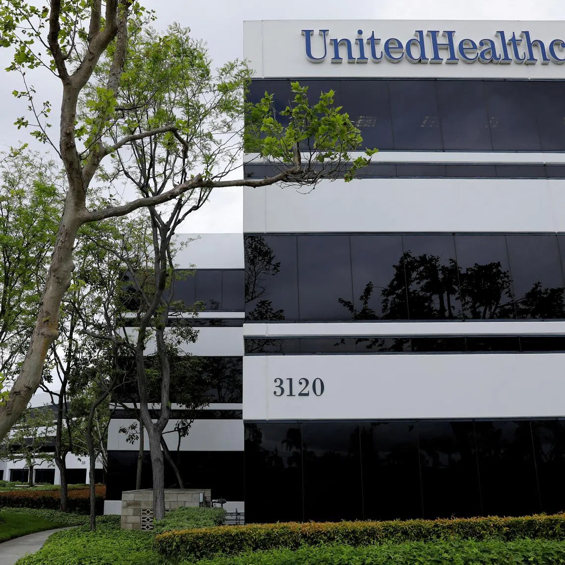 FILE PHOTO: The corporate logo of UnitedHealthcare, the insurance unit of UnitedHealth Group, appears on the side of one of their office buildings in Santa Ana, California, U.S., April 13, 2020. REUTERS/Mike Blake   REFILE - CORRECTING COMPANY NAME FROM "UNITEDHEALTH GROUP" TO "UNITEDHEALTHCARE, THE INSURANCE UNIT OF UNITEDHEALTH GROUP"./File Photo