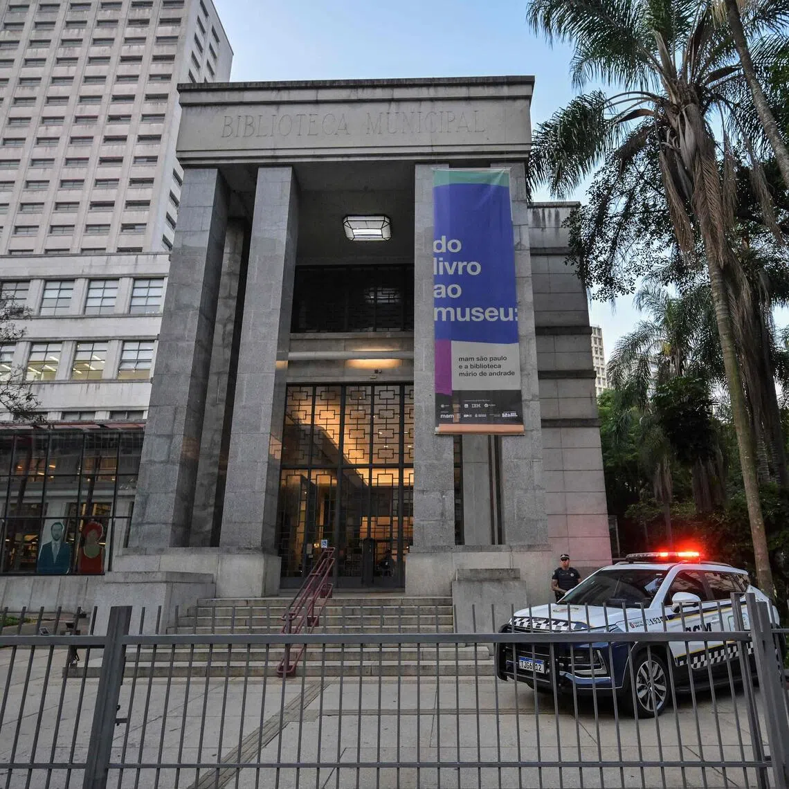 A Brazilian police patrol stands in front of the Mario de Andrade Public Library in downtown Sao Paulo, Brazil on Dec 7.