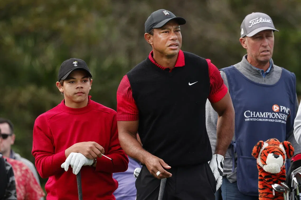 Tiger Woods (right) and his son Charlie Woods (left) during the final round of the PNC Championship golf tournament on Dec 18, 2022.