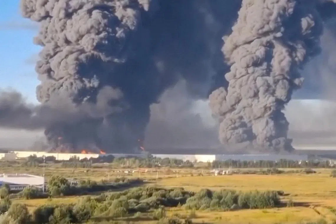 Smoke billows from a warehouse, after deadly Ukrainian drone attacks, as per regional governors, in Elektrostal, Moscow Region, Russia, July 18, 2026, in this screen grab obtained from a social media video. Social Media/via REUTERS