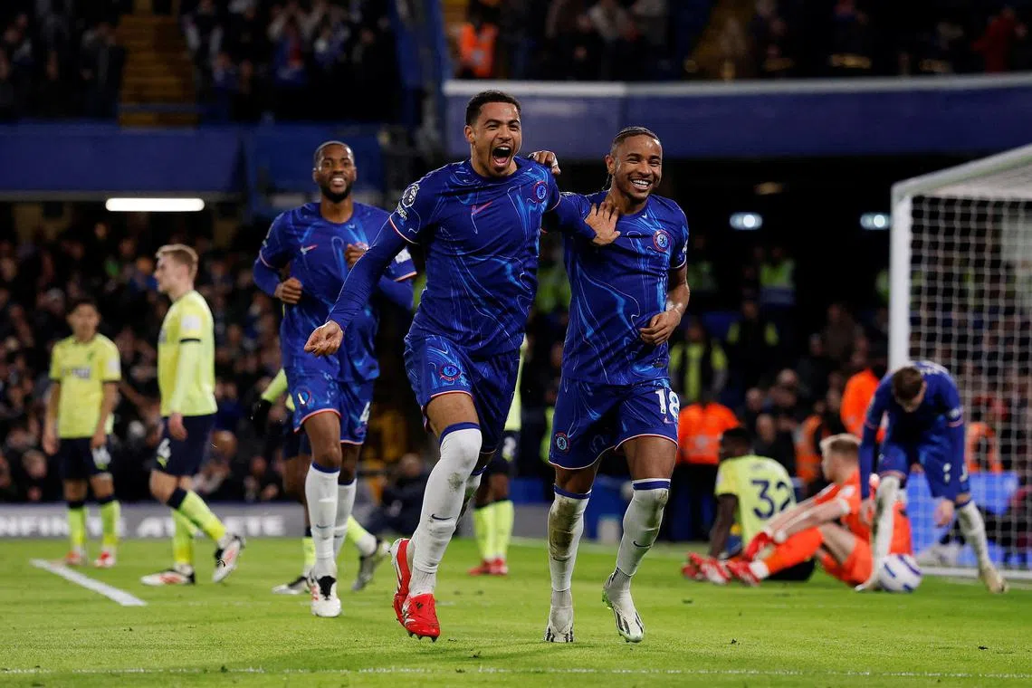 Chelsea's Levi Colwill celebrates scoring their third goal with teammate Christopher Nkunku.  