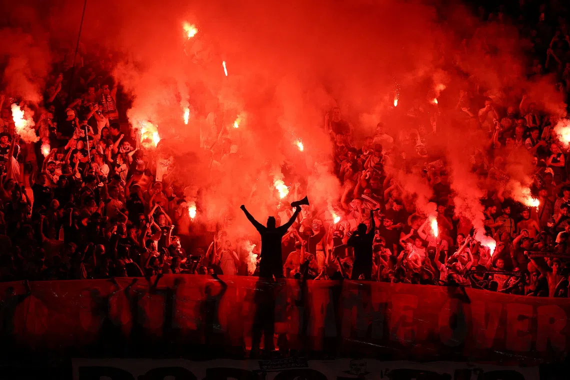 Soccer Football - Ligue 1 - Olympique de Marseille v Paris St Germain - Orange Velodrome, Marseille, France - September 20, 2026 Fans with flares REUTERS/Manon Cruz TPX IMAGES OF THE DAY