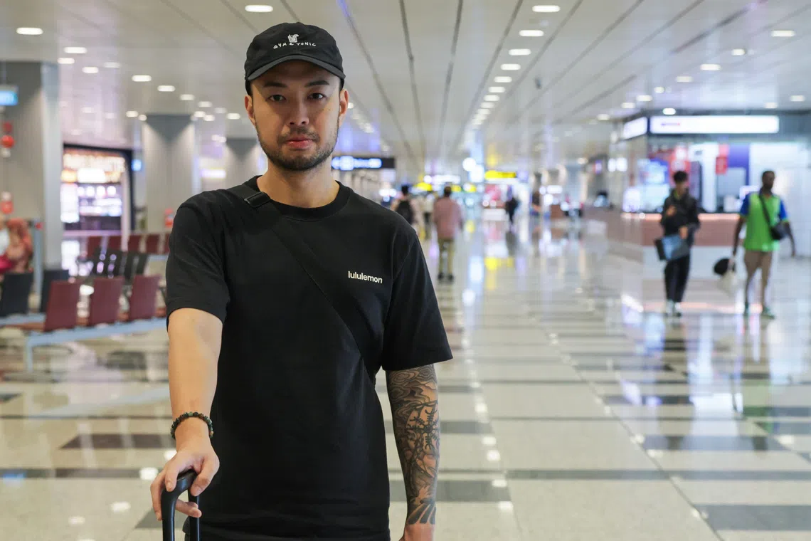Dominic Sum, general manager of Ushidoki restaurant, arrives at Changi Airport Terminal 3 from Jakarta on Sept 8, after flights between Singapore and Jakarta resumed following temporary disruptions caused by volcanic ash from Anak Krakatau.