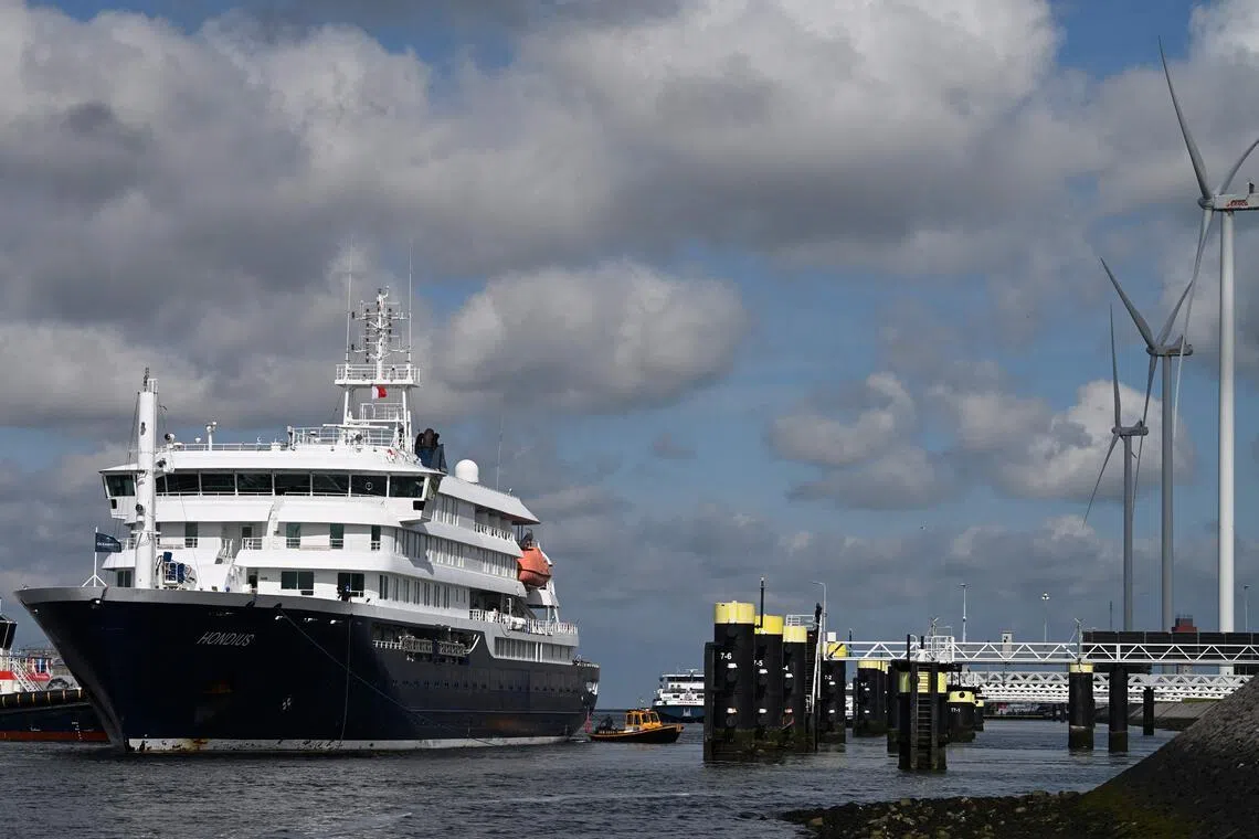 (FILES) The Dutch Hantavirus-hit cruise ship MV Hondius arrives to dock at the port of Rotterdam on May 18, 2026. The UN health agency on July 2, 2026 declared an end to the deadly hantavirus outbreak on a cruise ship which sparked international alarm, after the last person left quarantine. World Health Organization (WHO) chief Tedros Adhanom Ghebreyesus told a press conference he was "very pleased to say that WHO considers the outbreak of hantavirus over". (Photo by Nicolas TUCAT / AFP)