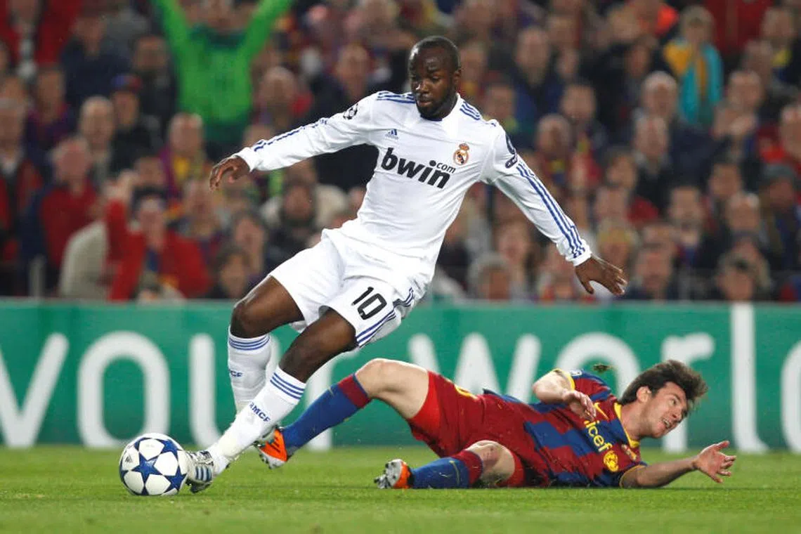  FILE PHOTO: Football - FC Barcelona v Real Madrid UEFA Champions League Semi Final Second Leg - The Nou Camp, Barcelona, Spain - 10/11 , 3/5/11 Lassana Diarra - Real Madrid in action against Lionel Messi - FC Barcelona Mandatory Credit: Action Images / Lee Smith/File Photo