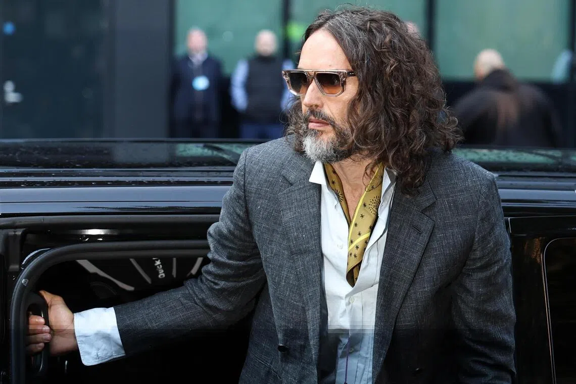 epa13315051 British comedian and actor Russell Brand arrives at Southwark Crown Court in London, Britain, 19 October 2026. Brand, whose trial began in October 2026, faces multiple counts of rape, sexual assault, and indecent assault.  EPA/NEIL HALL