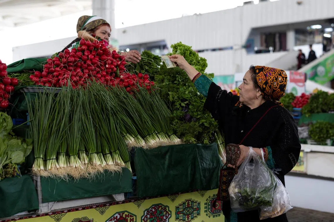 A woman buys vegetables at an open market in Ashgabat, Turkmenistan, in March Vegetable oil prices are particularly elevated amid the Iran war and the effective closure of the Strait of Hormuz.