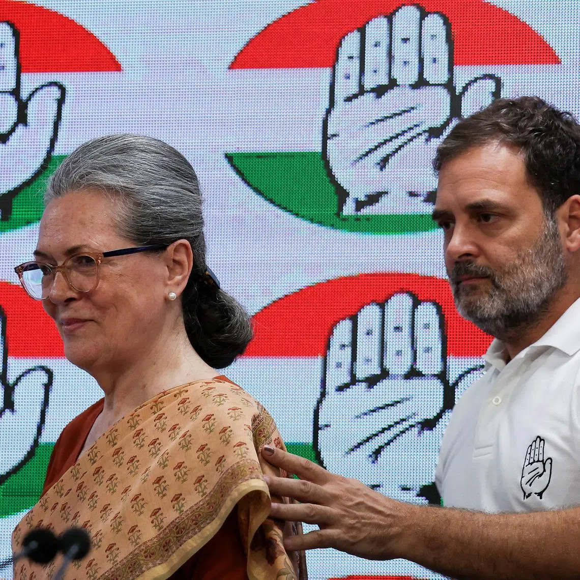 FILE PHOTO: Rahul Gandhi, a senior leader of India's main opposition Congress party, escorts Sonia Gandhi as they attend a press conference at the party's headquarter in New Delhi, India, June 4, 2024. REUTERS/Anushree Fadnavis/File Photo