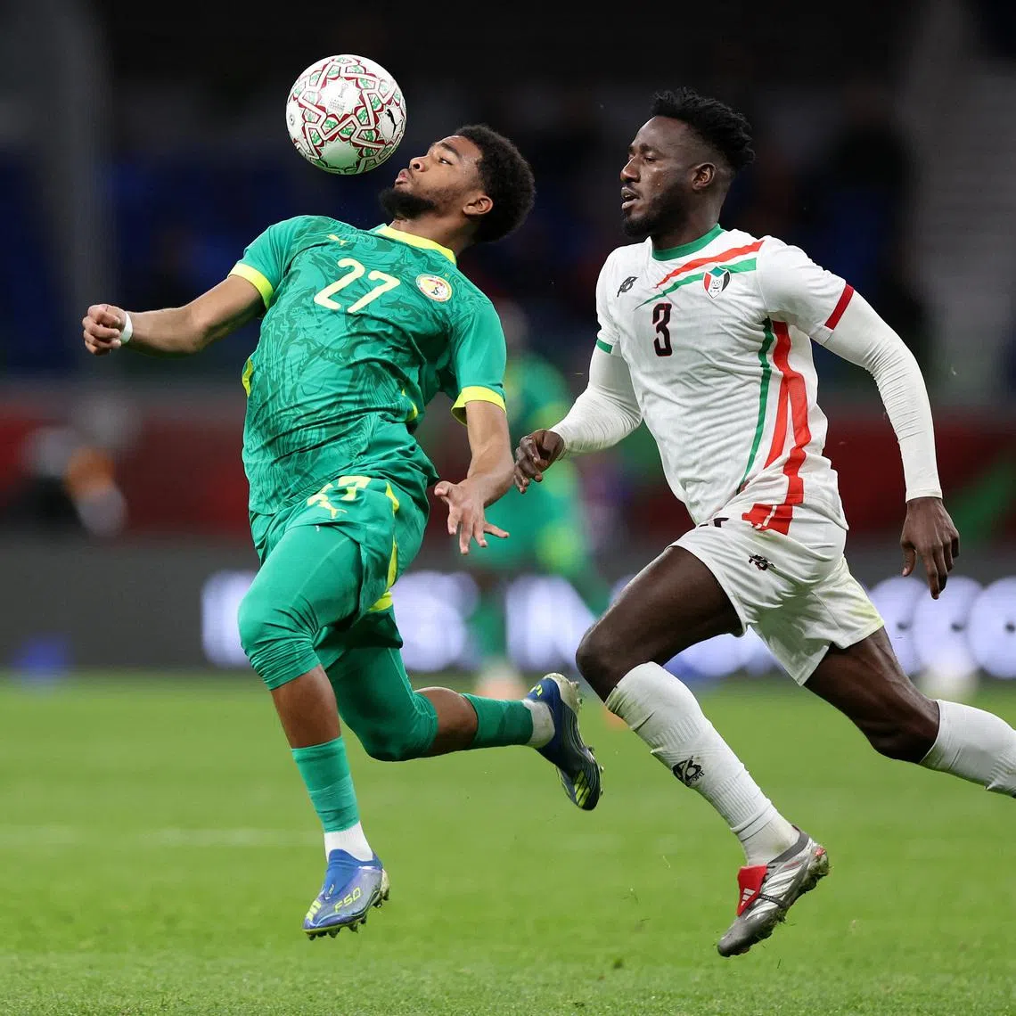 Soccer Football - CAF Africa Cup of Nations - Morocco 2025 - Round of 16 - Senegal v Sudan - Tangier Grand Stadium, Tangier, Morocco - January 3, 2026 Senegal's Ibrahim Mbaye in action with Sudan's Mohamed Saeed Ahmed REUTERS/Amr Abdallah Dalsh