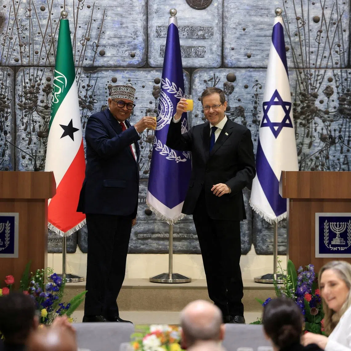 FILE PHOTO: Israel's President Isaac Herzog and Somaliland's President Abdirahman Mohamed Abdullahi hold up glasses of beverage before giving statements to the press at the President's Residence in Jerusalem, June 14, 2026. REUTERS/Ronen Zvulun/File Photo