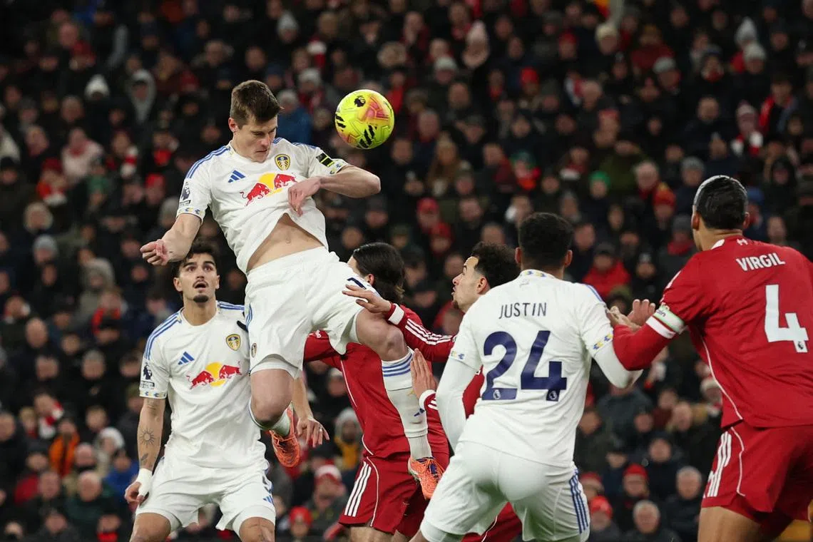 Soccer Football - Premier League - Liverpool v Leeds United - Anfield, Liverpool, Britain - January 1, 2026 Leeds United's Jaka Bijol in action with Liverpool's Curtis Jones. REUTERS/Phil Noble
