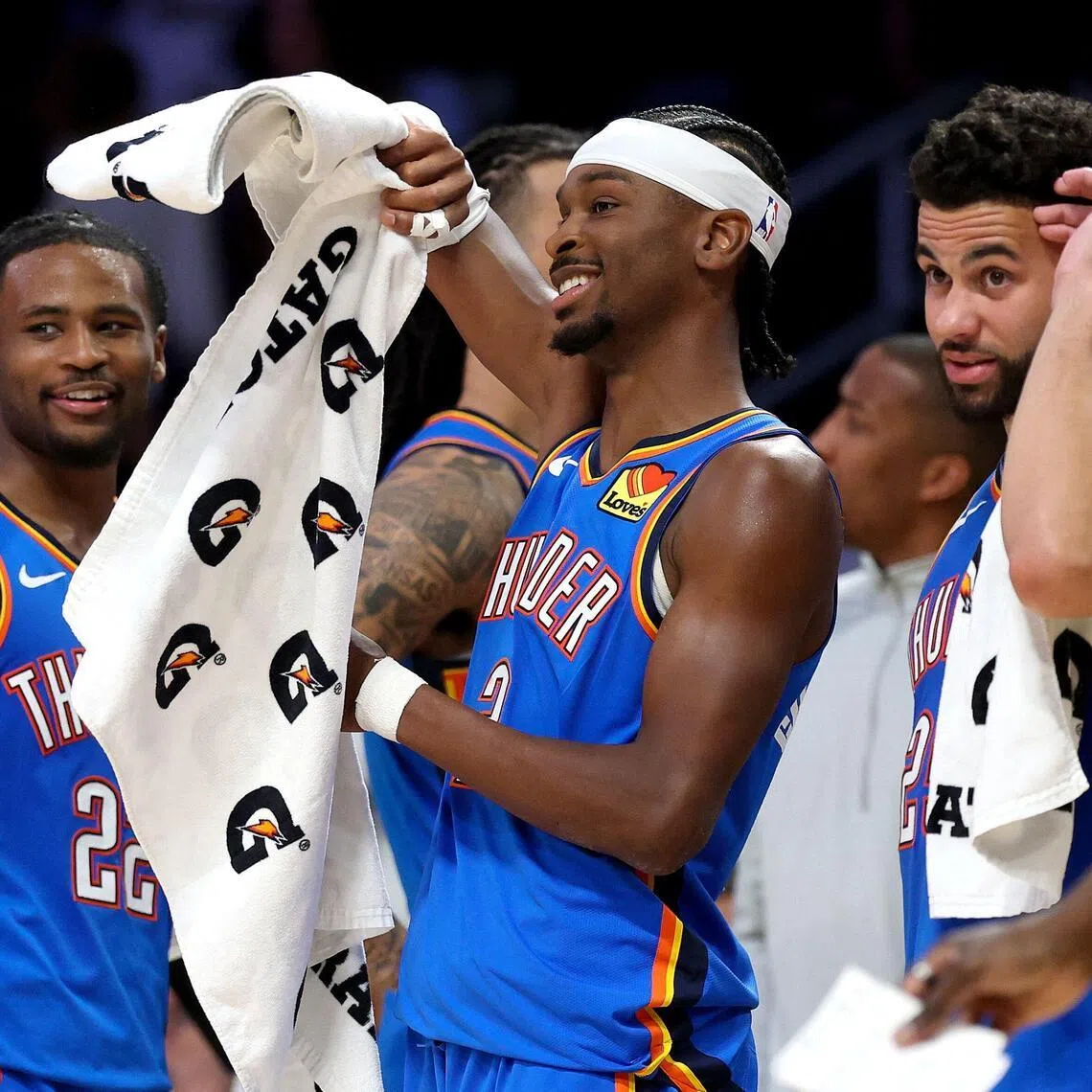 From left: Cason Wallace, Shai Gilgeous-Alexander and Ajay Mitchell of the Oklahoma City Thunder celebrating from the bench during the fourth quarter of the  the 131-108 win over the Los Angeles Lakers in the NBA Western Conference semi-finals on May 9, 2026.