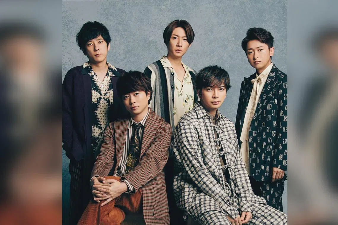 J-pop boy band Arashi's (second row, from left) Kazunari Ninomiya, Masaki Aiba, Satoshi Ohno, (front row, from left) Sho Sakurai and Jun Matsumoto are donating about $620,000.