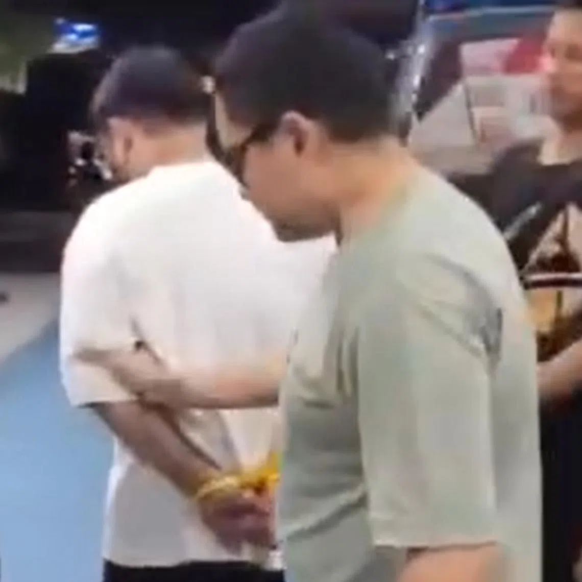 Police said the Singaporean man (in white) had tried to flee towards Sanur before he was arrested.