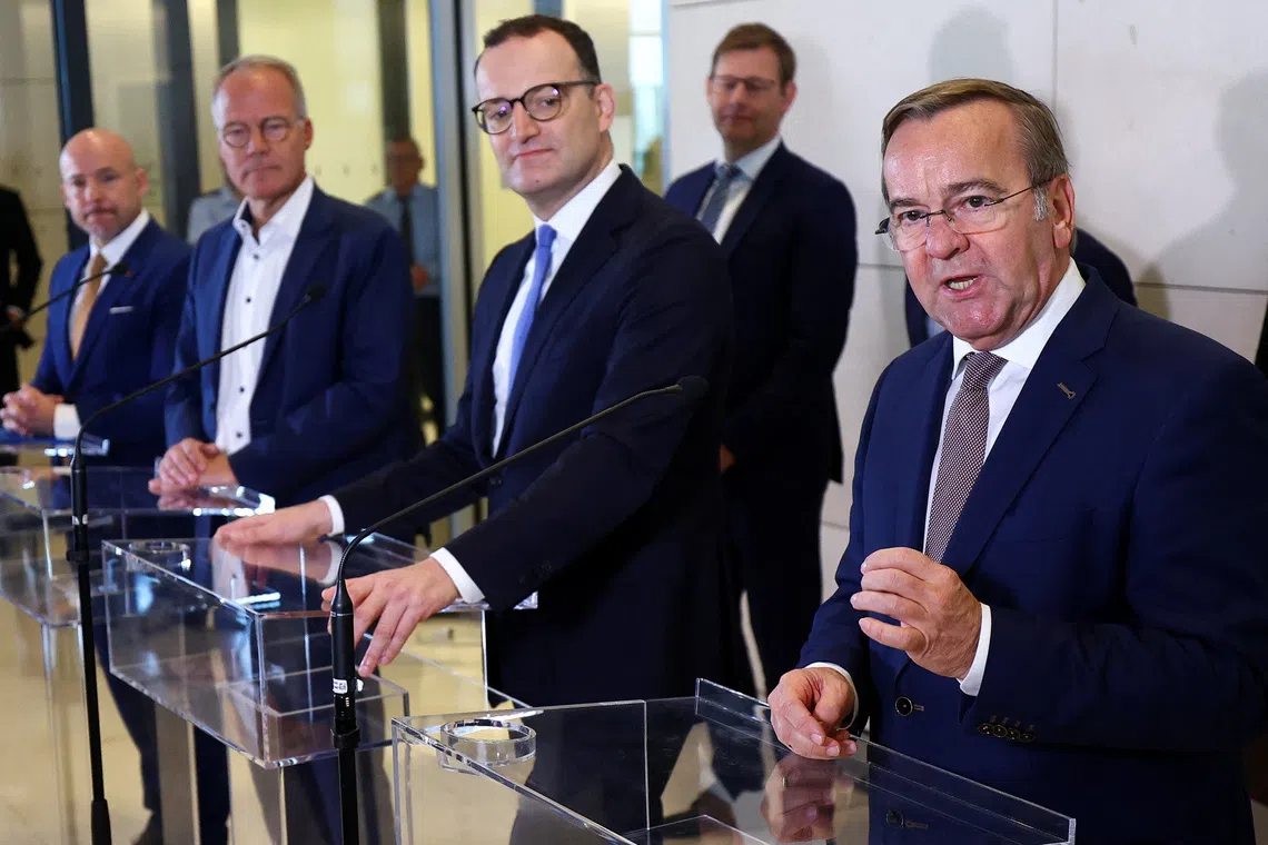 German Defence Minister Boris Pistorius addresses the media with CDU/CSU parliamentary group leader Jens Spahn and Social Democratic Party's (SPD) parliamentary group leader Matthias Miersch at the lower house of parliament, the Bundestag, in Berlin, Germany, November 13, 2025. REUTERS/Lisi Niesner