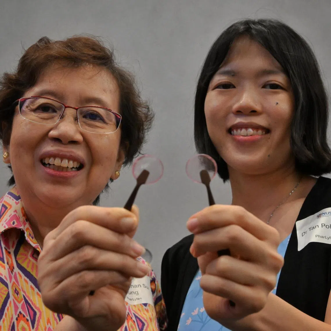 Slug: mhgrip28
ST PHOTO: Chong Jun Liang

From left: Associate Professor Chan Sui Yung and Dr Tan Poh Leng from PharLyfe  each show a sample of buccal film at the NUS Graduate Research Programme (GRIP) Lift-Off Day 2023 on June 28, 2023. 

****

14 NUS teams will be presenting their solutions at Lift-Off Day on 28 June 2023 to an audience comprising industry, venture capitalists and incubators in a bid to secure funding as well as partnership and collaboration opportunities.