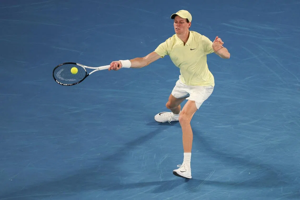 Italy's Jannik Sinner hits a return against Germany's Alexander Zverev during their men's singles final match on day fifteen of the Australian Open tennis tournament in Melbourne on January 26, 2025. (Photo by Adrian Dennis / AFP) / -- IMAGE RESTRICTED TO EDITORIAL USE - STRICTLY NO COMMERCIAL USE --