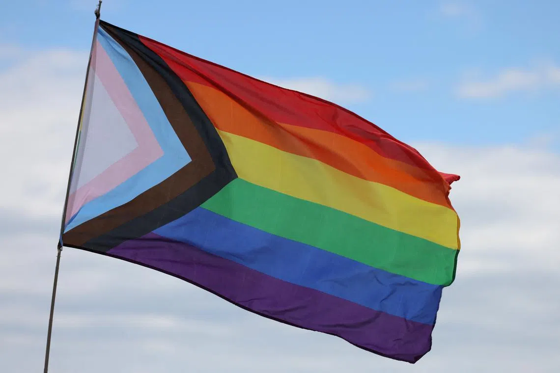 FILE PHOTO: A \"Progress Pride Flag\" flies at the Brighton Beach Pride march, in Brooklyn, New York City, U.S., May 19, 2024. REUTERS/Andrew Kelly/File Photo