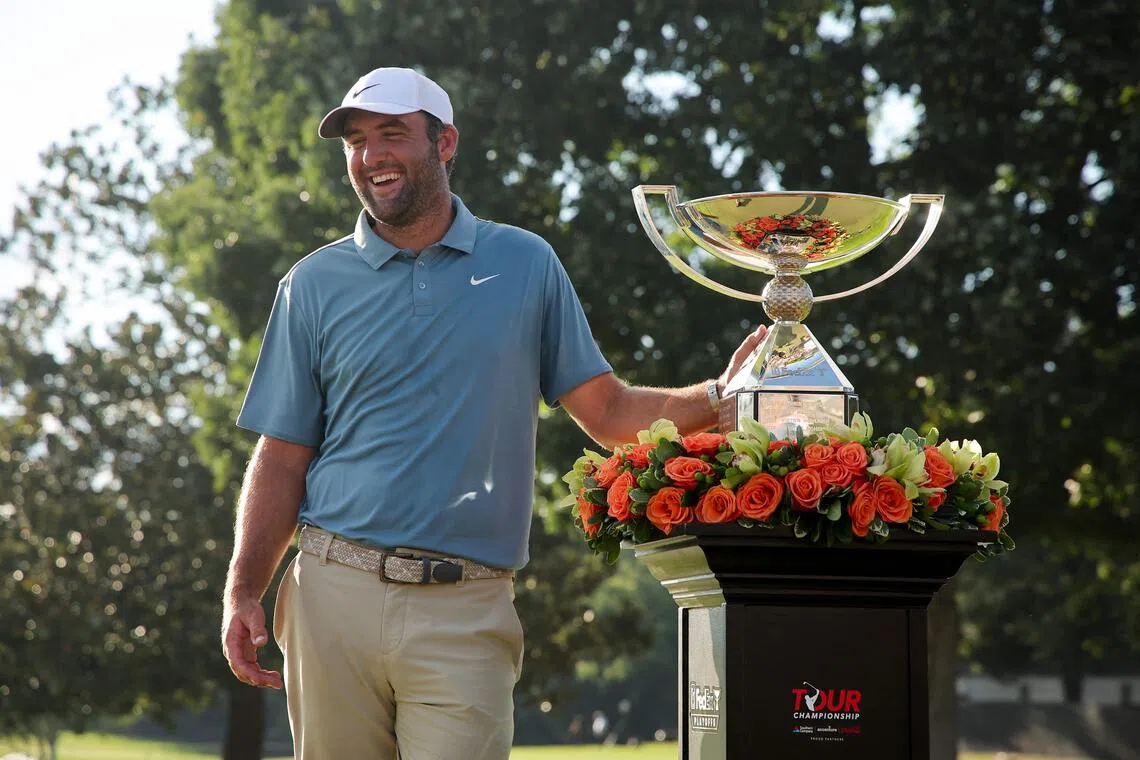 Scottie Scheffler all smiles with his trophy after the American came from behind to clinch the Tour Championship at East Lake Golf Club in Atlanta on Aug 30.