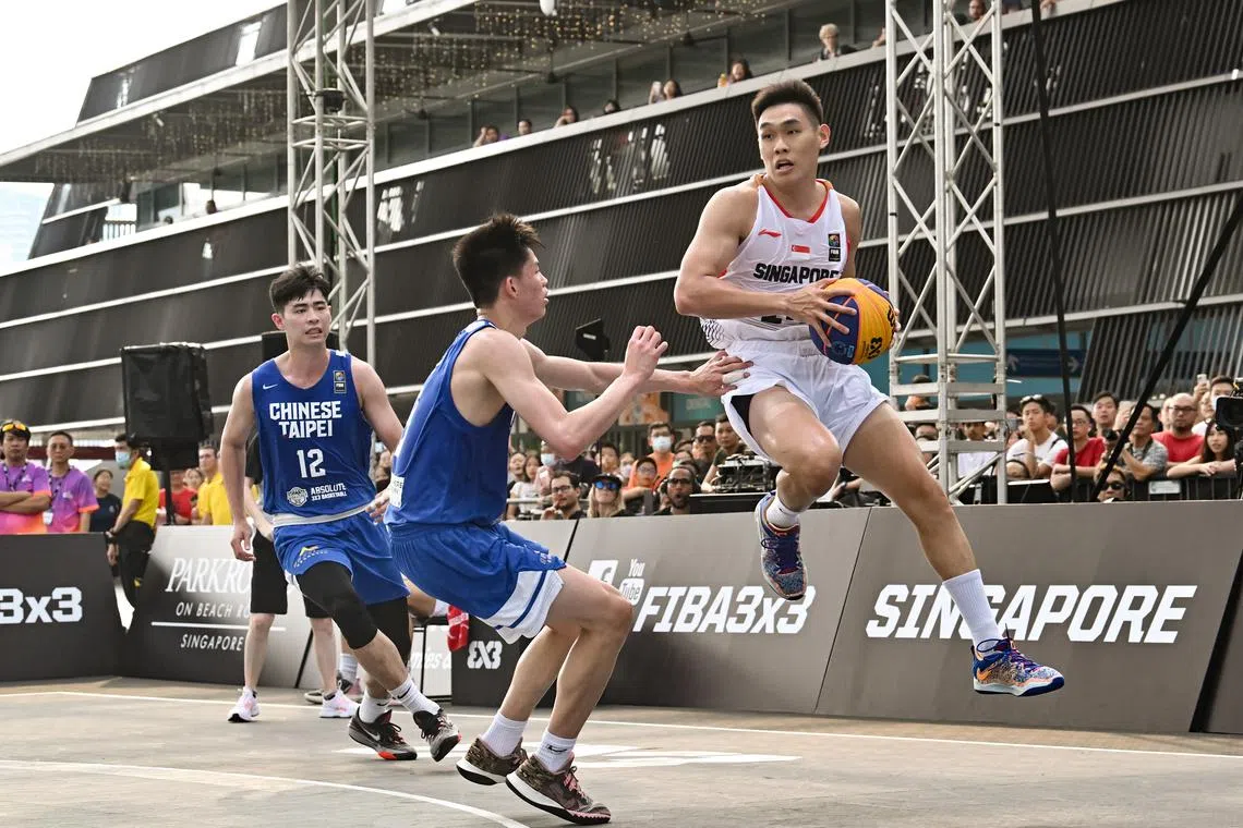 ST20230401-202395933772-Lim Yaohui-pixfiba/

Branson Tan from Singapore catches the ball.  

Singapore vs Chinese Taipei - Men Pool A. Singapore won 22-20. 

Day 4 of FIBA 3x3 Asia Cup 2023 at OCBC Square on Apr 1, 2023.  

FIBA 3x3 Asia Cup will be returning to Singapore, from 29 March to 2 April. In contrast to the 5v5 games or 13-player NBA matches, each 3x3 match is played by fewer players, of only 3 (and 1 on the bench) for each team, on a significantly smaller court. This sixth edition of the FIBA 3x3 Asia Cup will take place at the Singapore Sports HubÕs OCBC Square for the first time. It will feature 43 teams from 24 different countries and the emerging champions will earn a place in the qualifiers for the Paris 2024 Olympic Games.

(ST PHOTO: LIM YAOHUI)