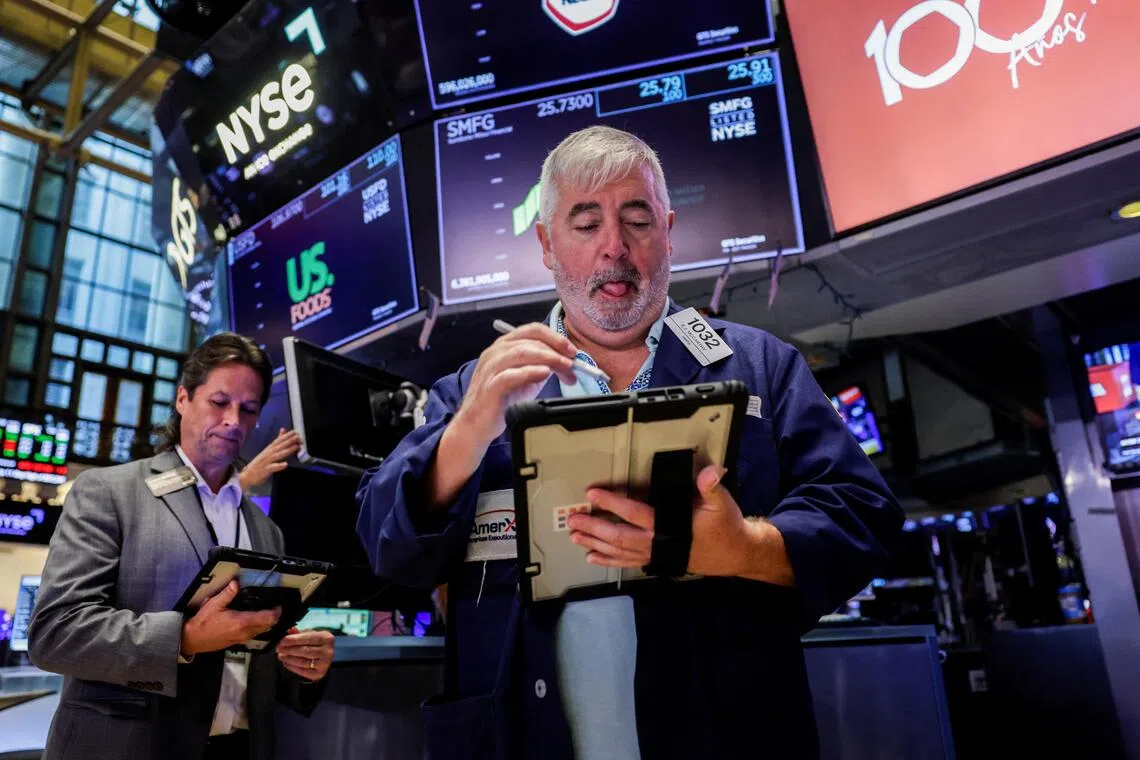 Traders working on the floor of the New York Stock Exchange, in New York City, on Aug 7.