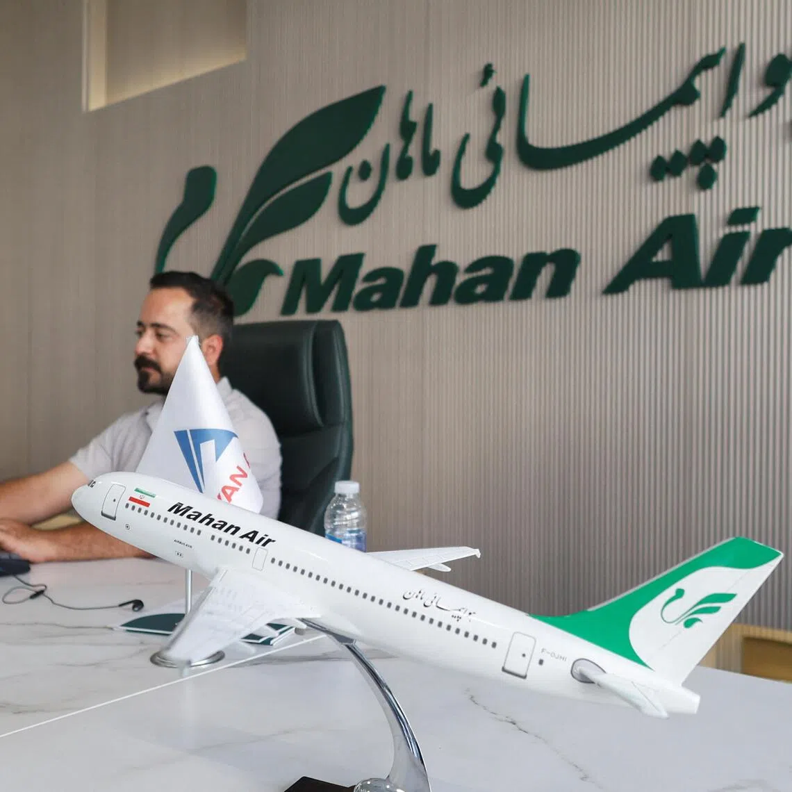 An employee working at the office of Iran’s Mahan Air in Erbil, Iraq, on Sept 22.