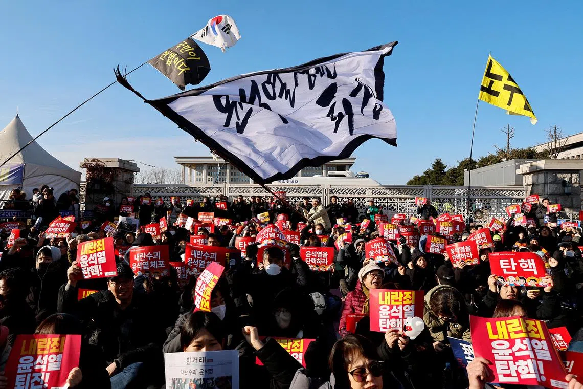 Protesters take part in a rally calling for the impeachment of South Korean President Yoon Suk Yeol, who declared martial law, which was reversed hours later, in front of the National Assembly in Seoul, South Korea, December 7, 2024. REUTERS/Kim Soo-hyeon TPX IMAGES OF THE DAY